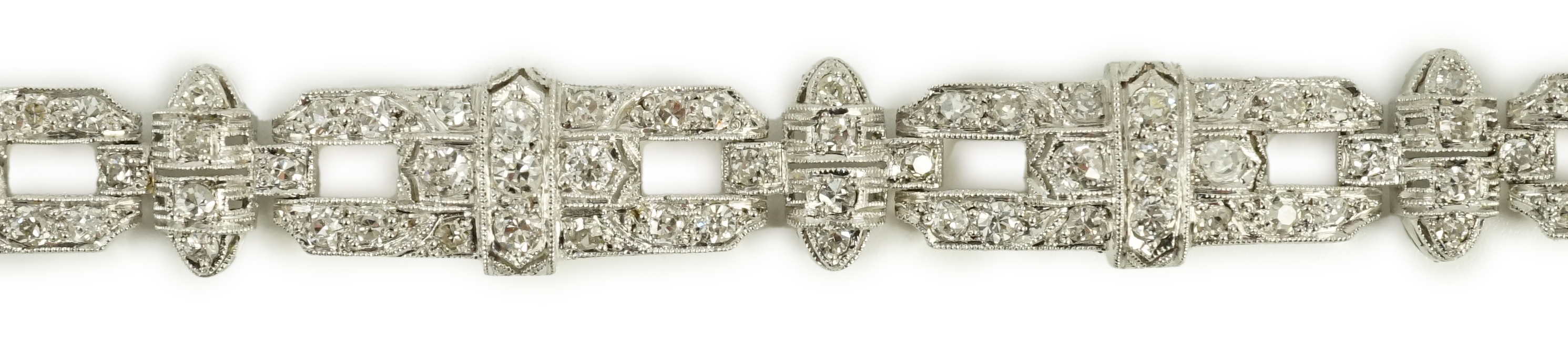 An Art Deco style pierced platinum and diamond cluster set bracelet